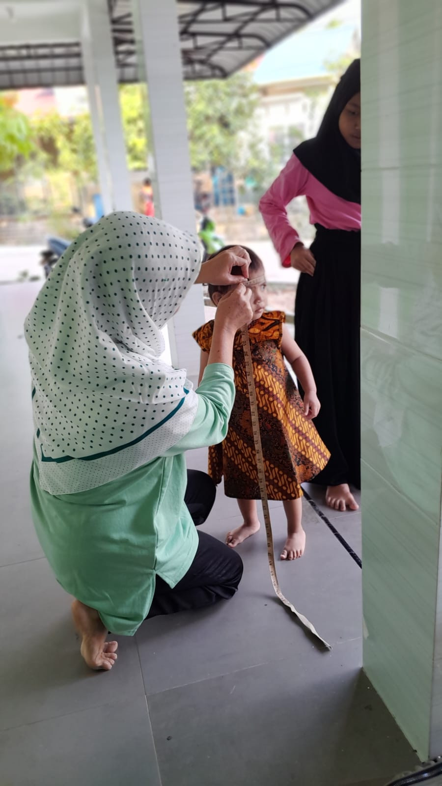 Monitoring/ Sweeping Tumbuh Kembang Anak Oleh Kader Posyandu Balita MELATI di Perumahan Duta Paragon Rt 04 Rw 02 Kelurahan Pinang Kencana