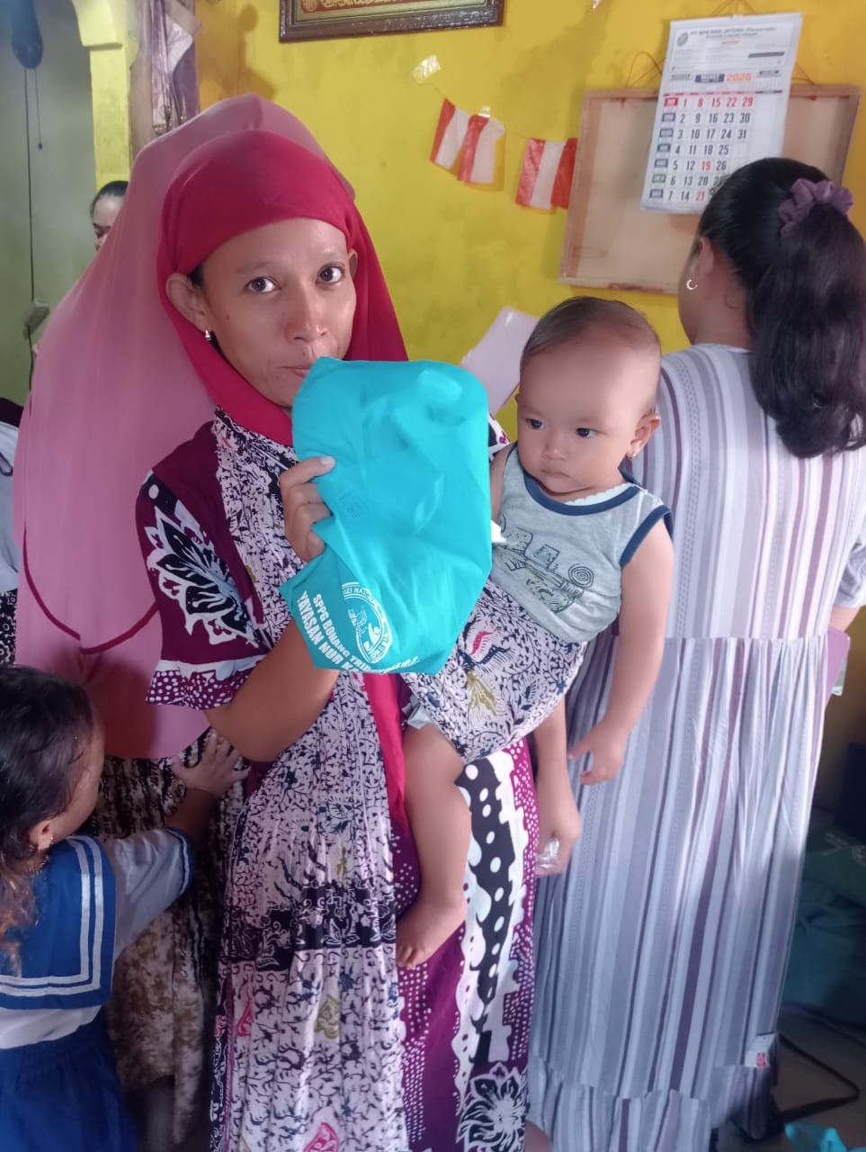 Pembagian MBG pada kegiatan posyandu Balita