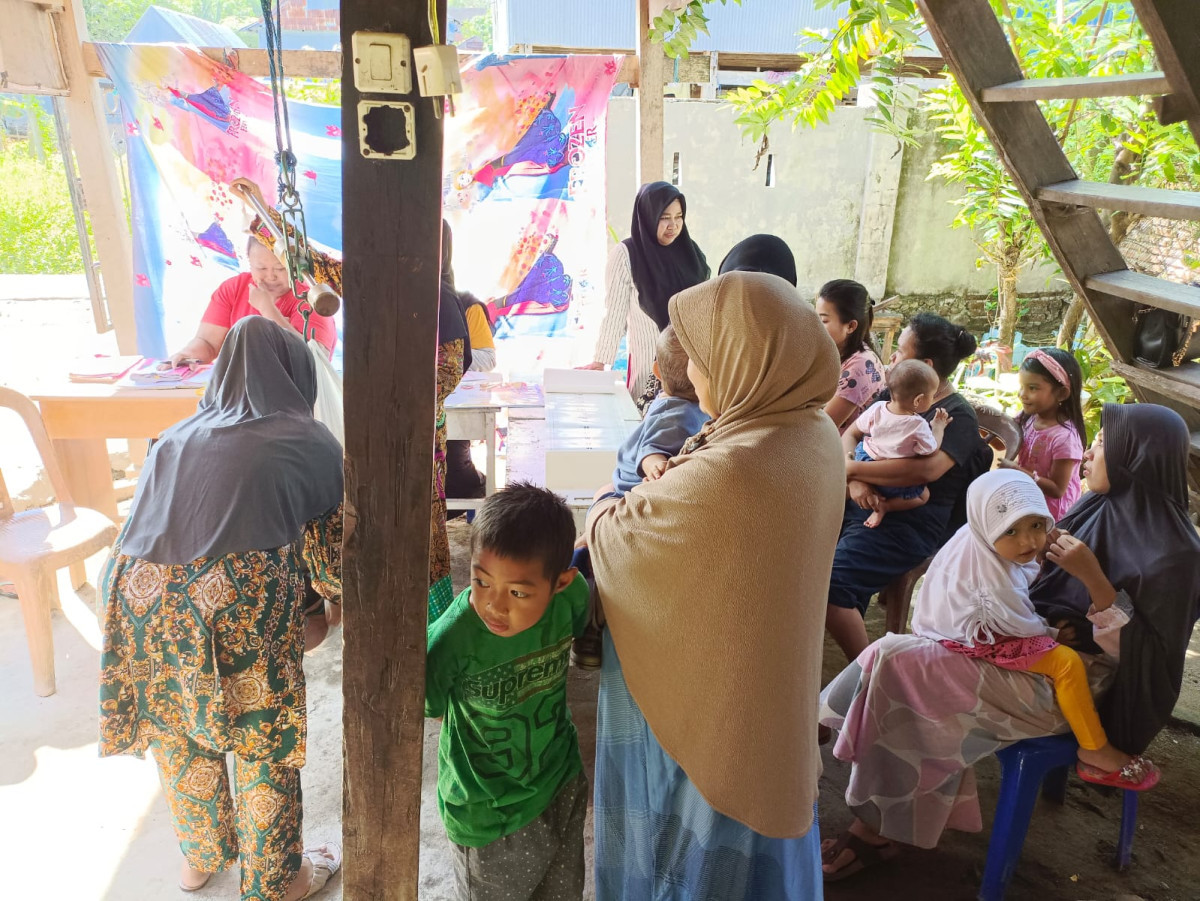 Melaksanakan Kegiatan Posyandu