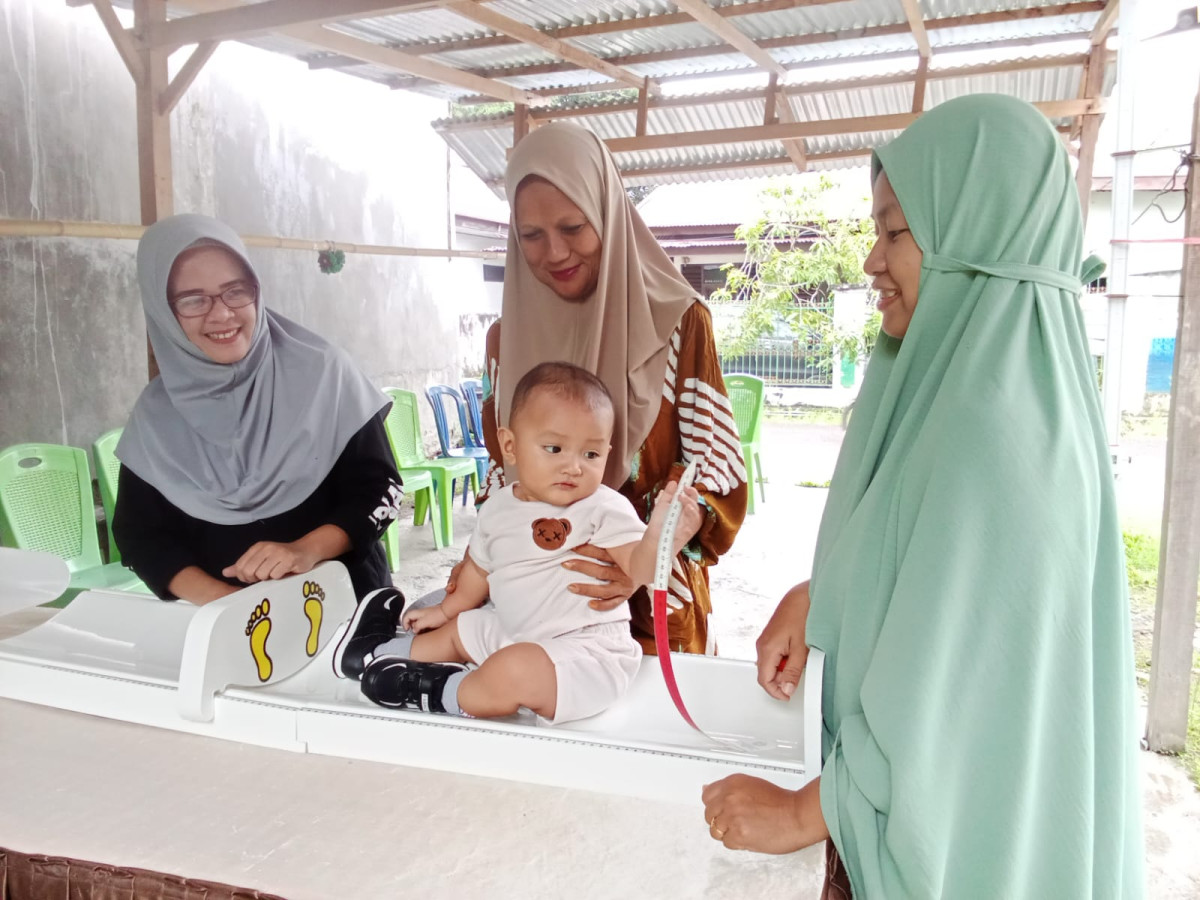 Melaksanakan Kegiatan Posyandu