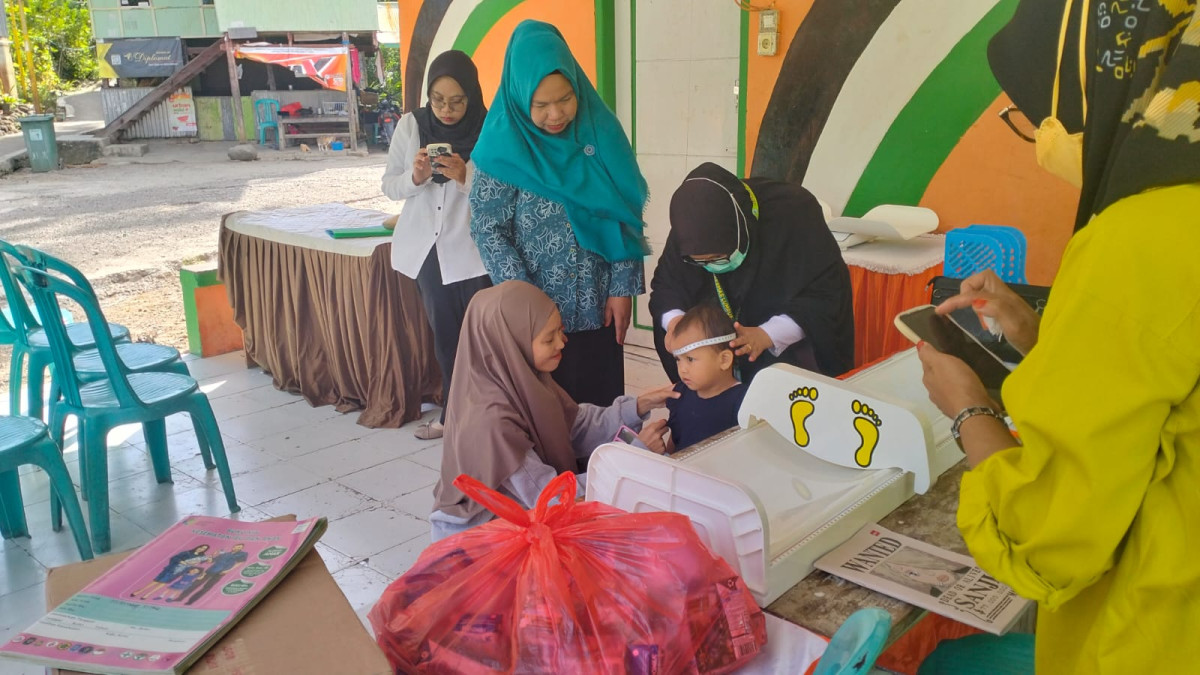 Melaksanakan Kegiatan Posyandu