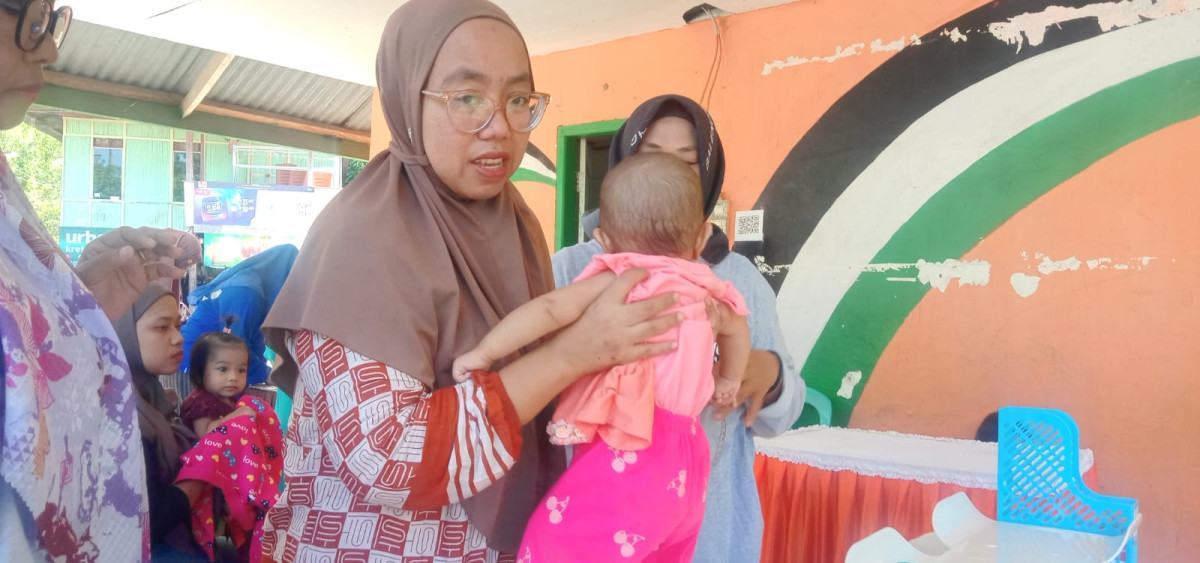 Melaksanakan Kegiatan Posyandu